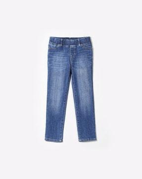 1969 high stretch mid-wash jeans
