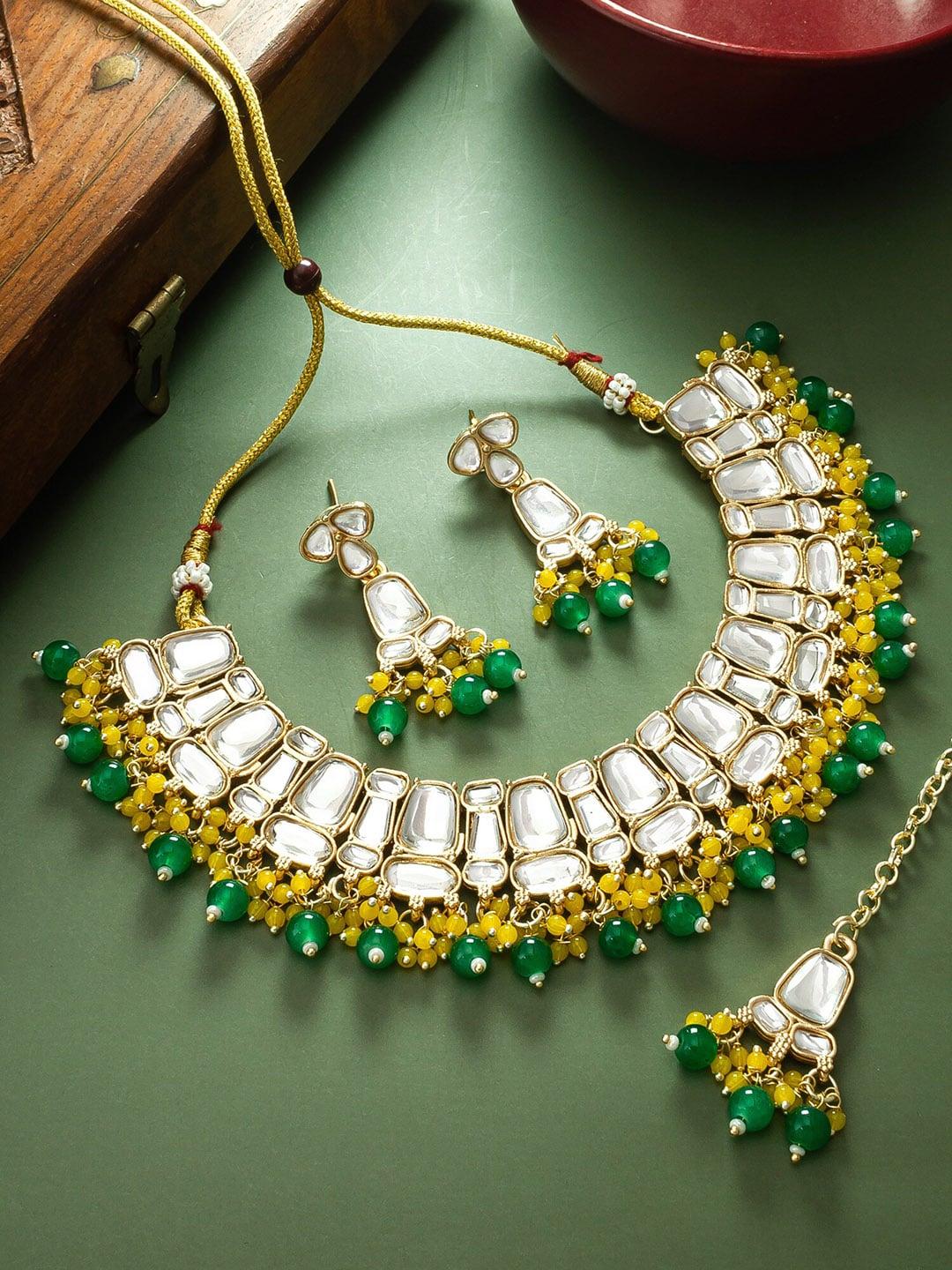 aadita gold-plated kundan-studded jewellery set