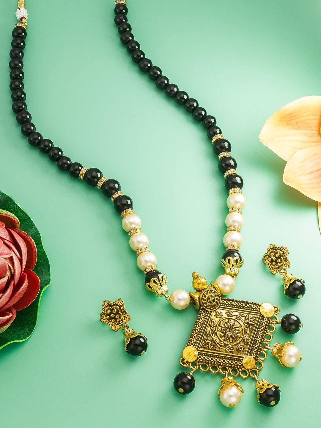aadita stone studded & pearls studded temple jewellery set
