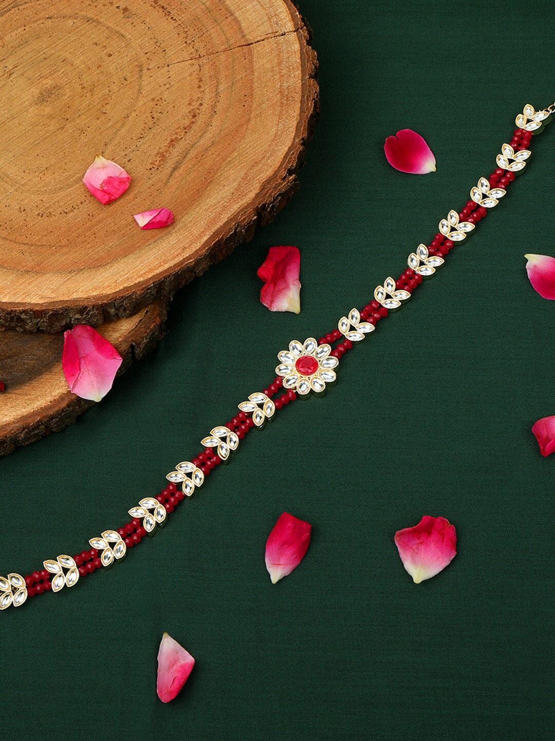 accessher gold-plated white kundan studded & red beaded mathapatti
