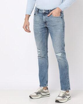 acid mid-wash distressed jeans