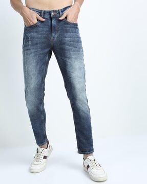 acid mid-wash distressed tapered fit jeans