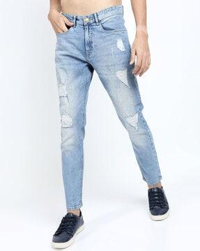 acid-wash tapered fit distressed jeans