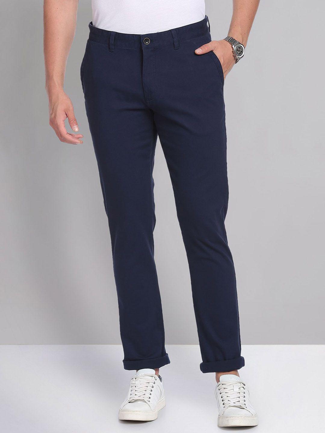 ad by arvind men flat-front mid-rise slim fit regular trousers