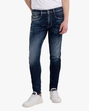 aged mid-wash skinny fit jeans