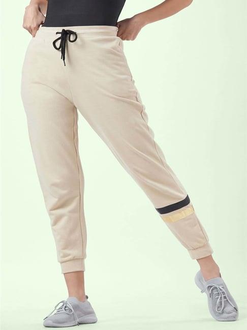 ajile by pantaloons beige cotton graphic print trackpants