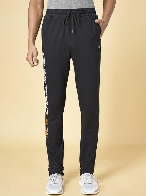 ajile by pantaloons black cotton slim fit printed trackpants