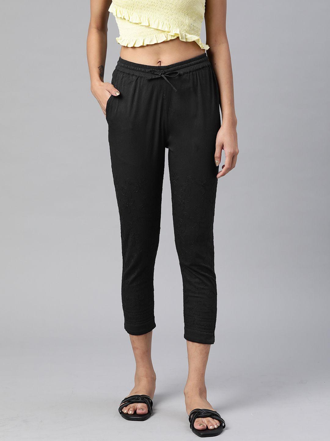 akheri women black solid skinny fit cropped trousers with embroidered detail