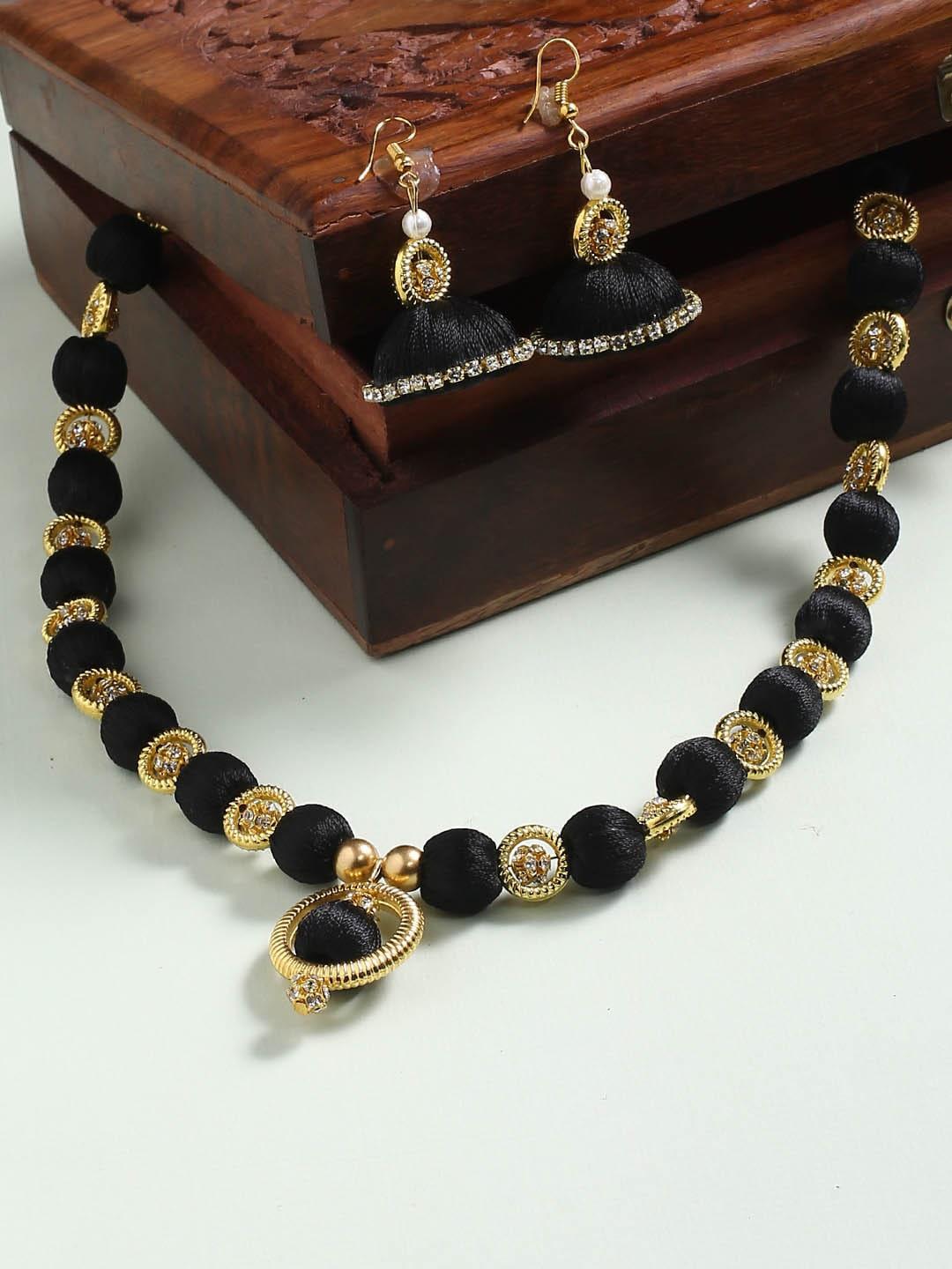 akshara brass-plated black & gold-toned thread wrapped jewellery set