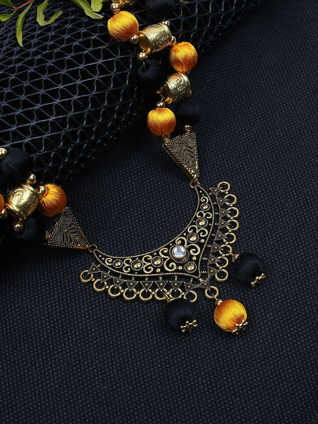 akshara womenblack & gold-toned handcrafted brass necklace