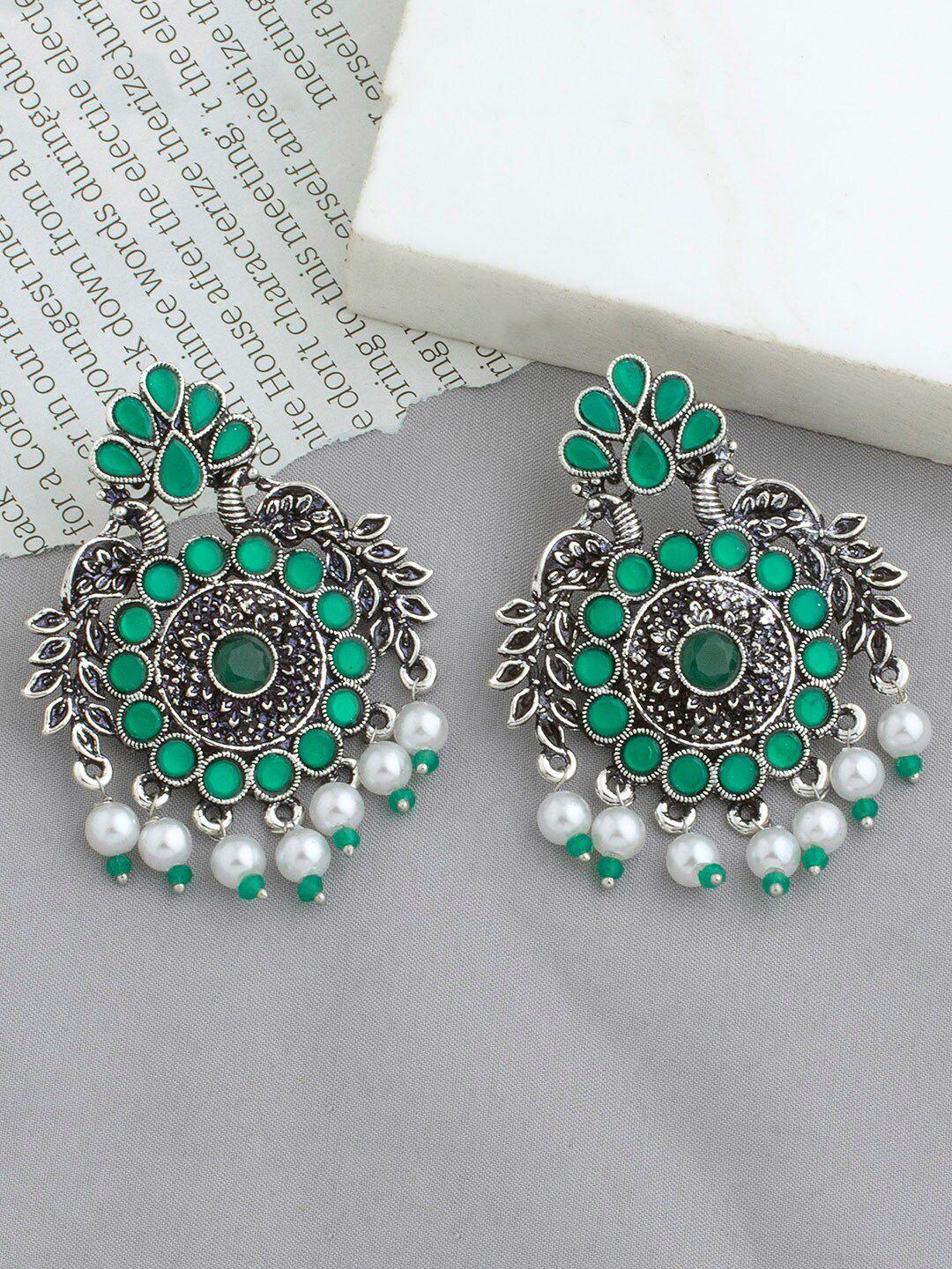 alamod peacock shaped silver-plated chandbali  earrings