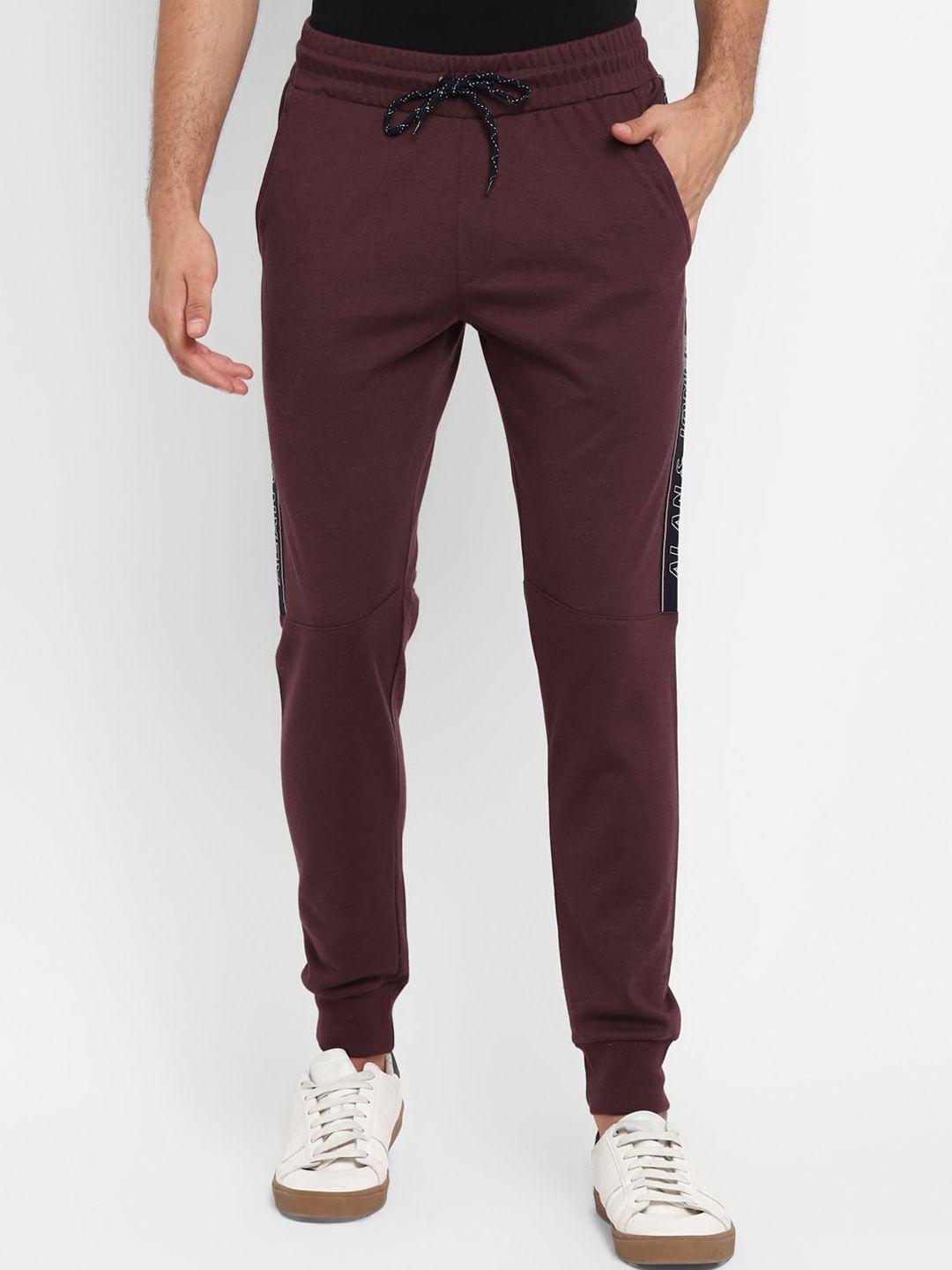 alan jones men maroon solid slim-fit track pants