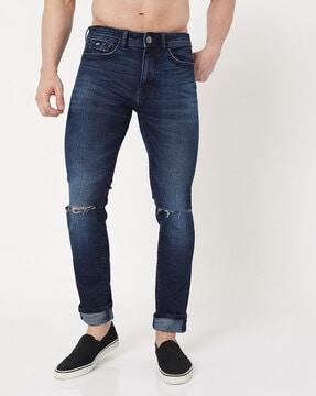 albert mid-wash slim fit jeans with distressing