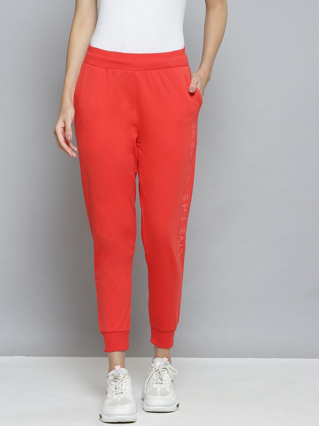 alcis women coral red slim fit solid cropped running joggers