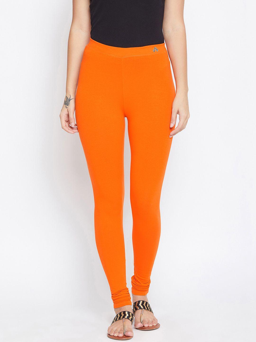 aliza women orange solid churidar-length leggings