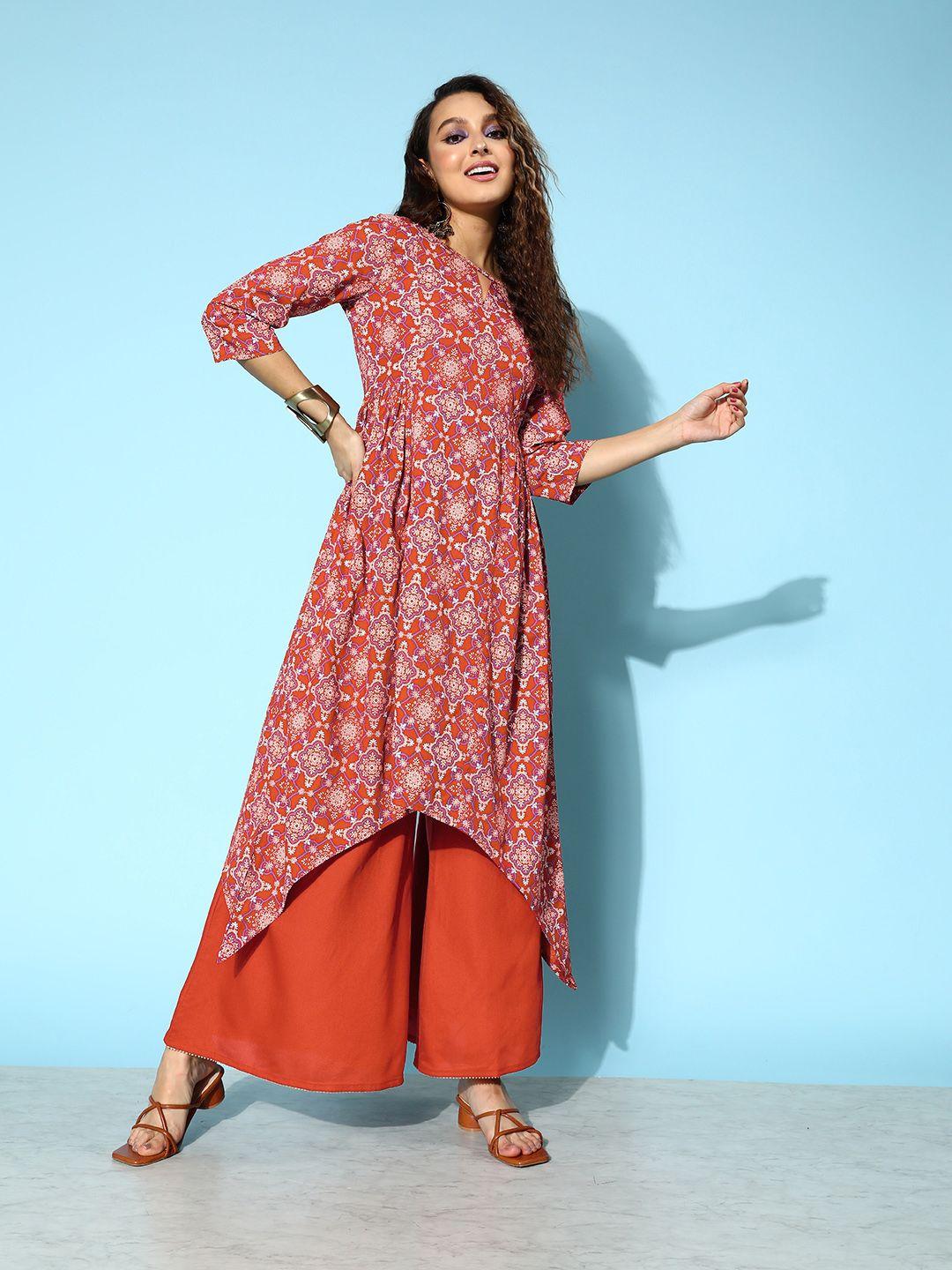 all about you brick red printed dipped hem veere di wedding a-line kurta with palazzos