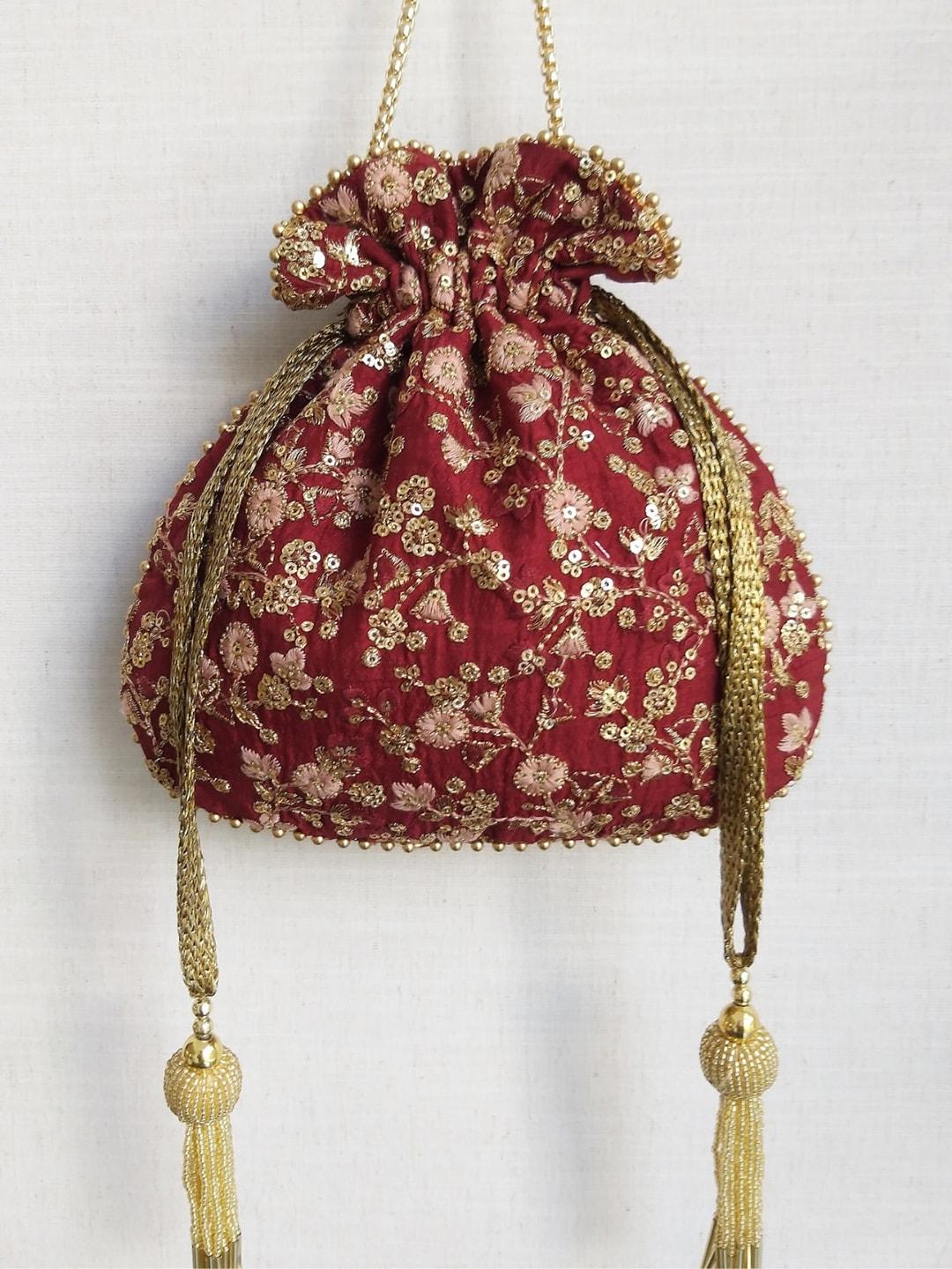 amyra embroidered sequinned potli bag