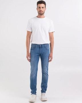 anbass medium wash mid-rise slim fit aged jeans