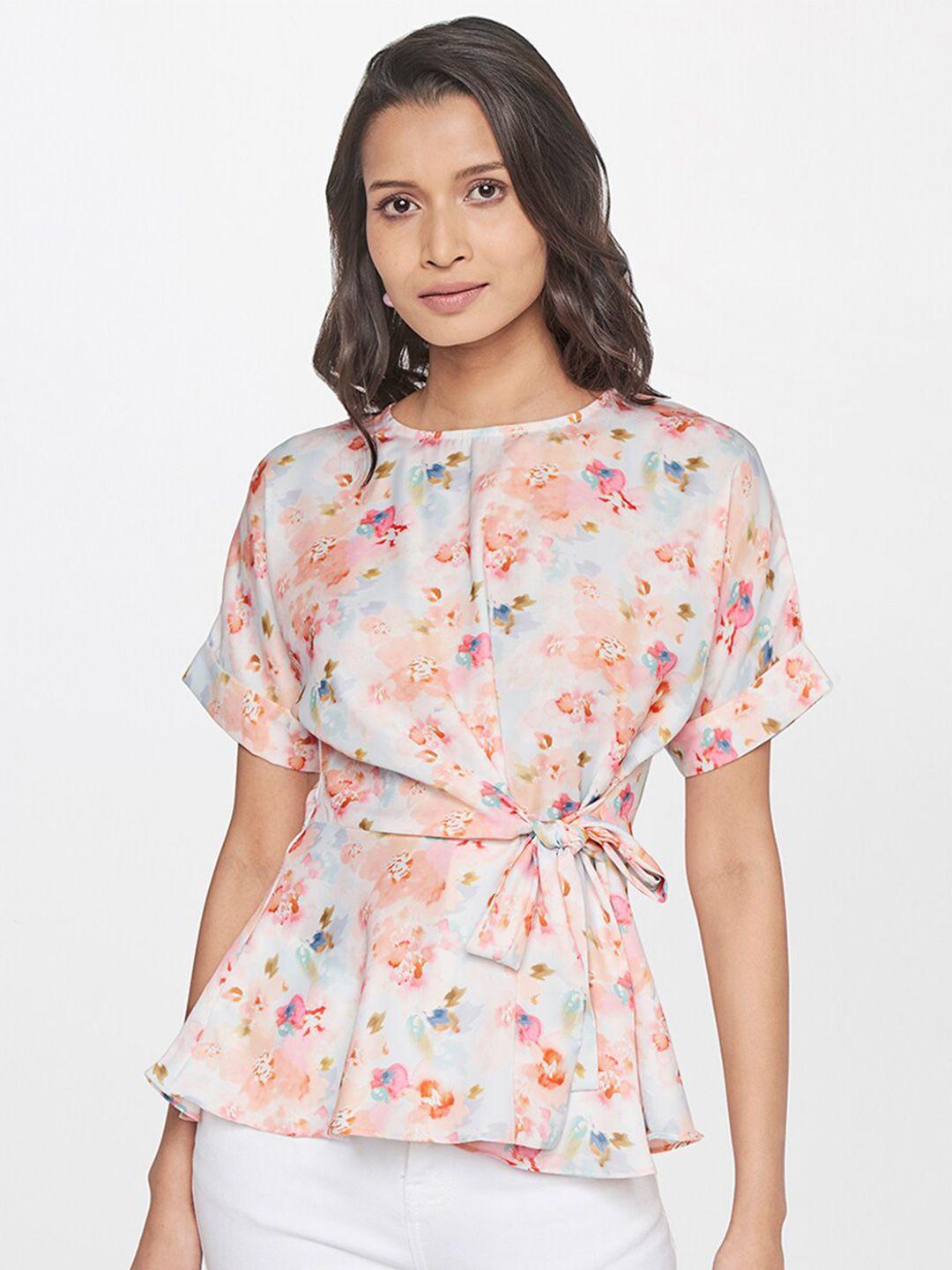 and peach-coloured floral print shirt style top