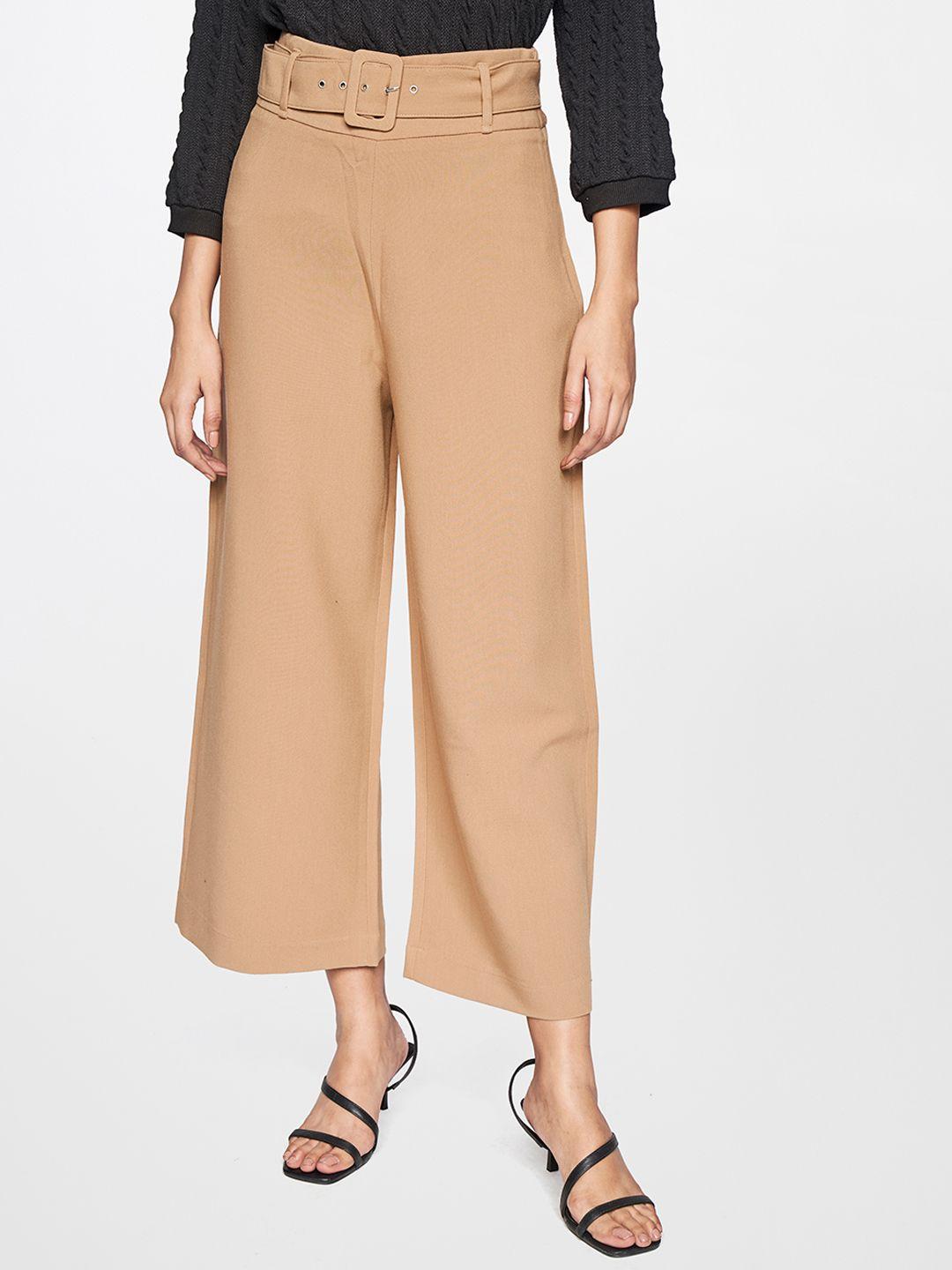 and women beige cropped trousers