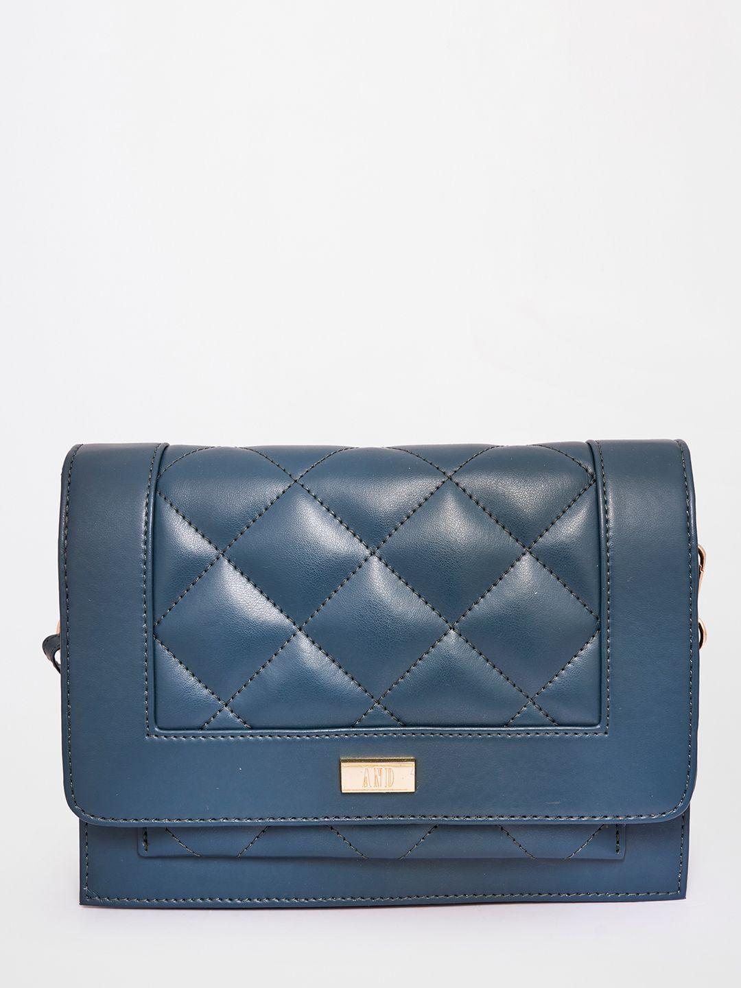 and women teal blue structured sling bag with quilted