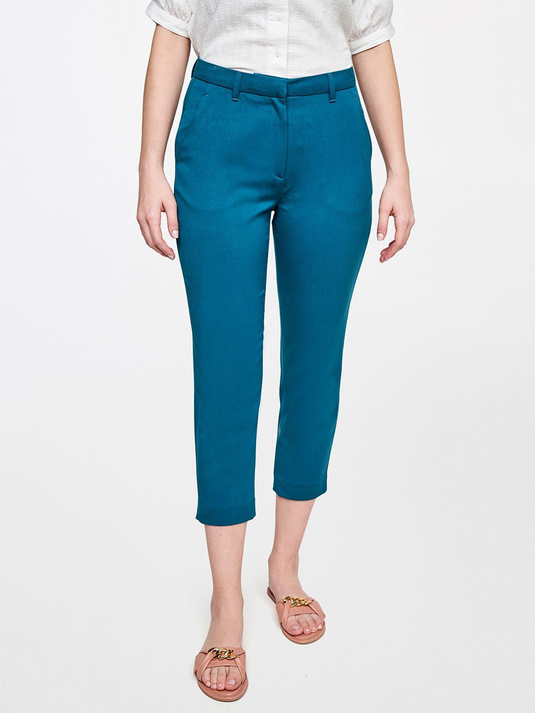 and women teal solid casual tapered fit trousers