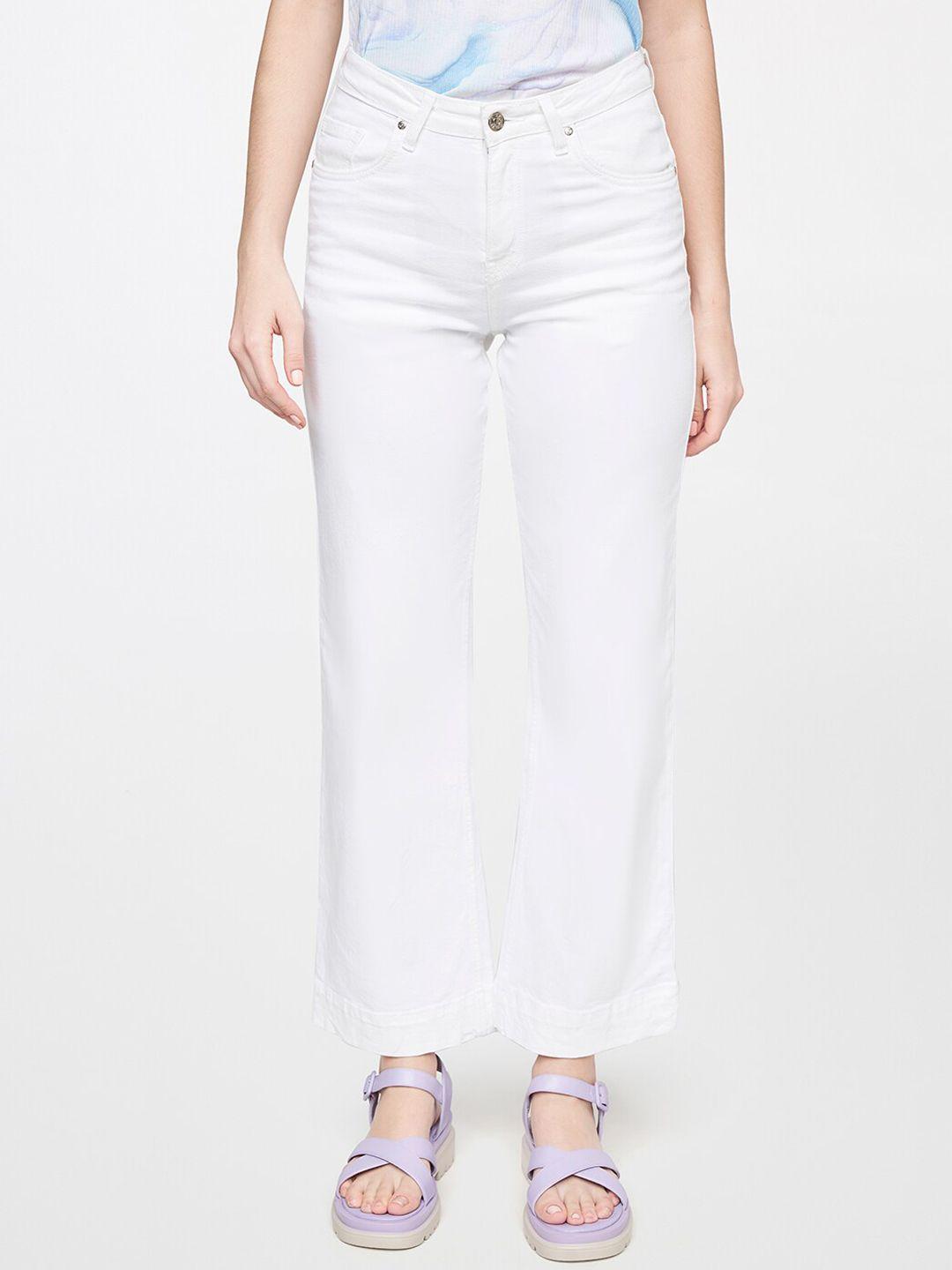 and women white solid flared trousers