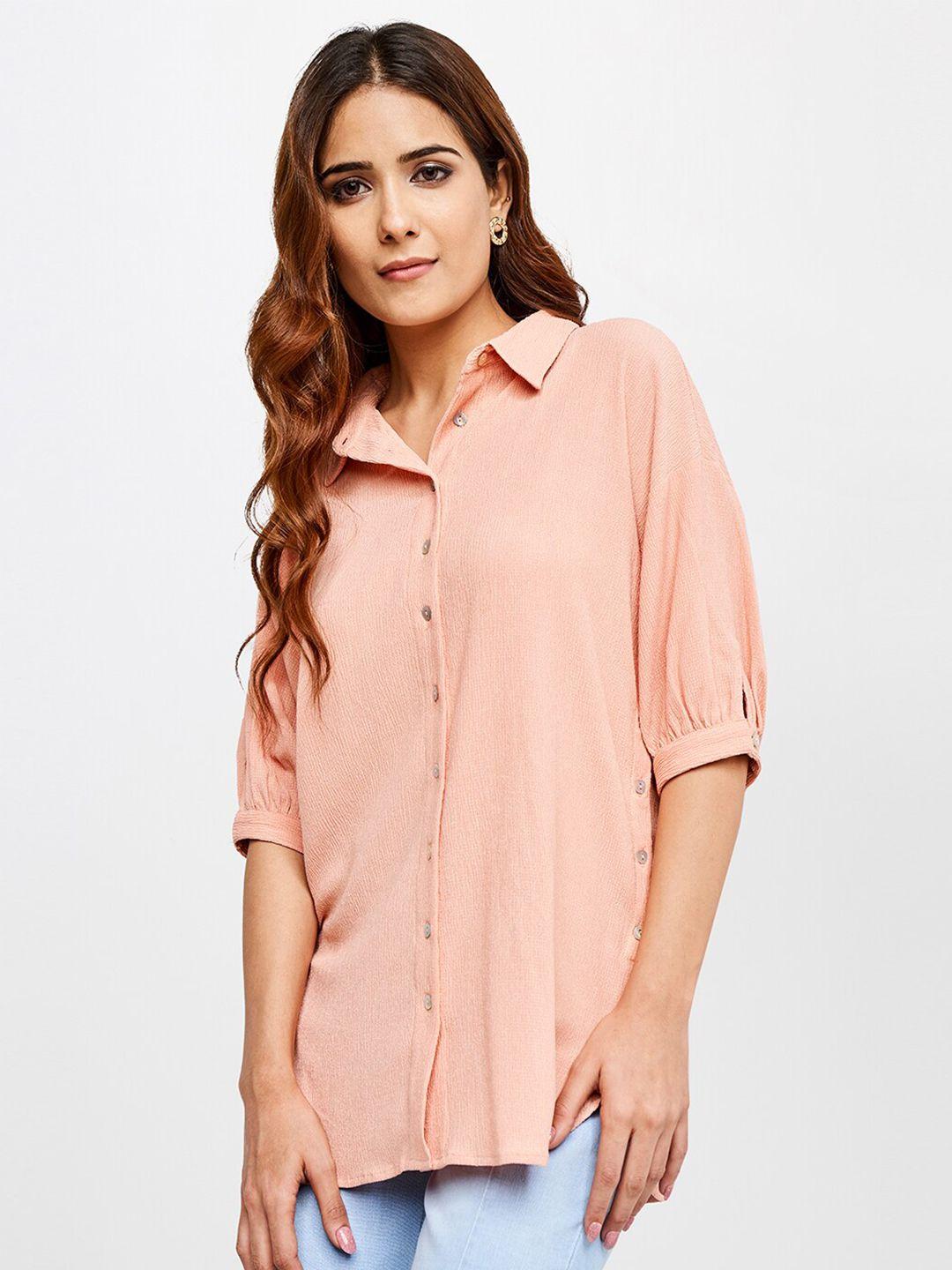 and peach-coloured shirt style longline top