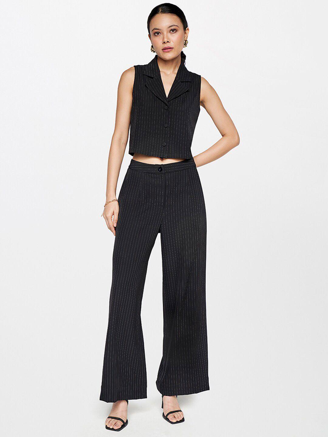 and v-neck sleeveless top with trousers