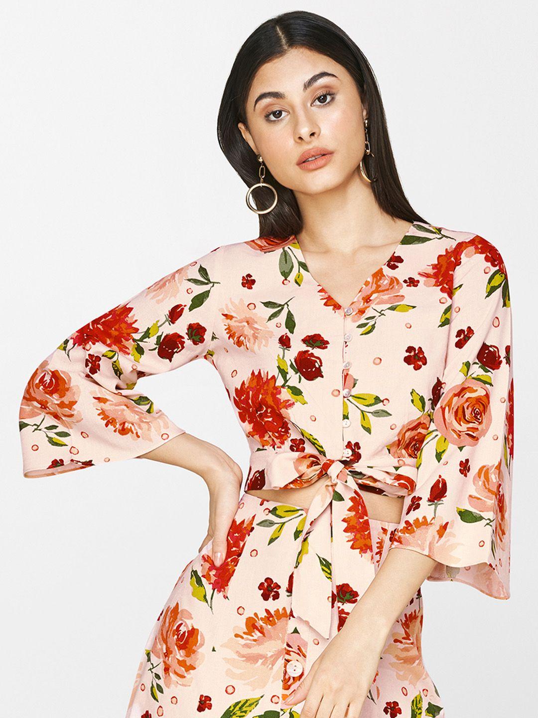 and women beige & peach-coloured floral print top