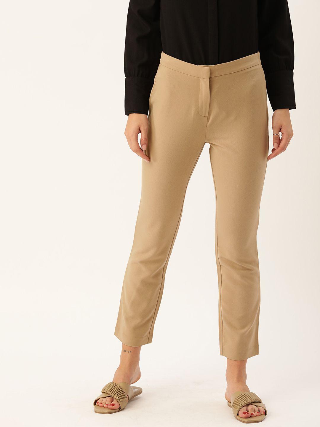 and women beige solid mid-rise slim fit trousers