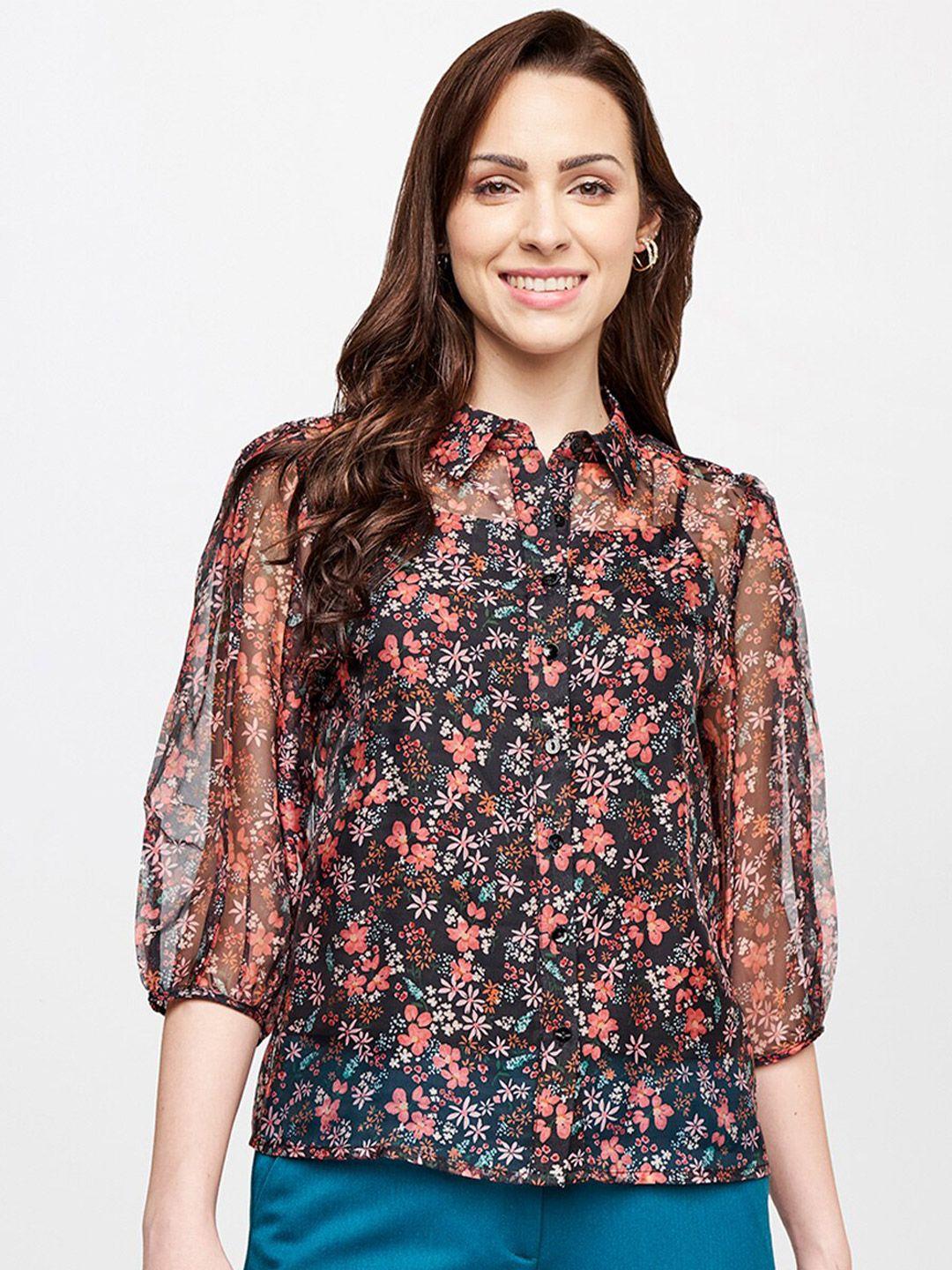 and women black & peach coloured floral print shirt style top