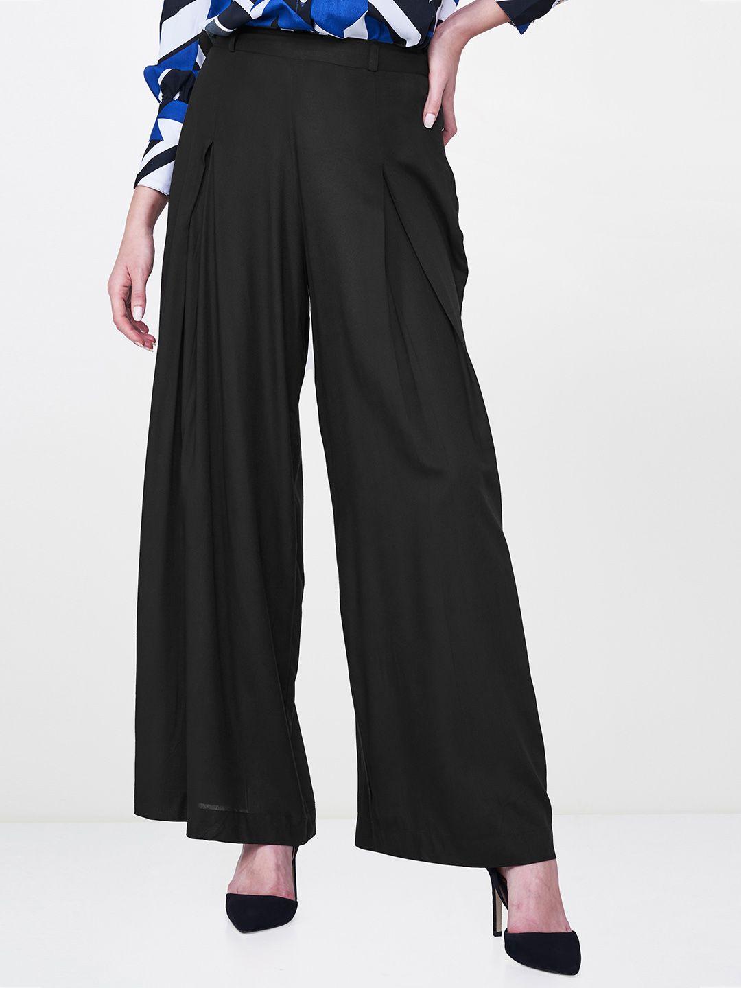 and women black regular fit solid parallel trousers