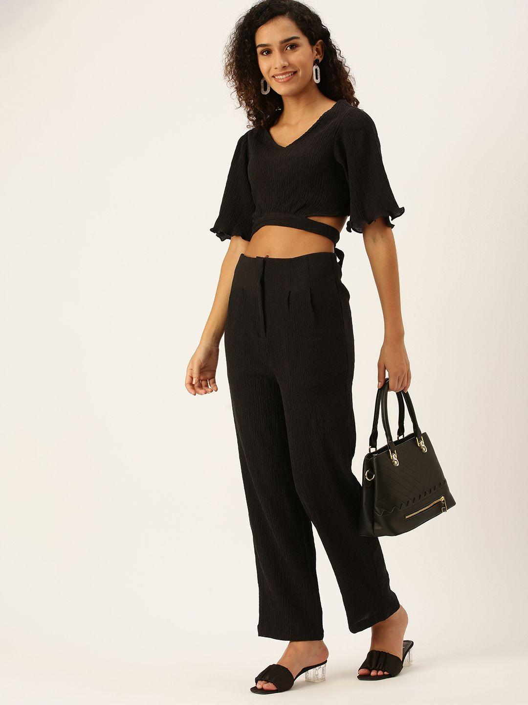 and women black top with trousers