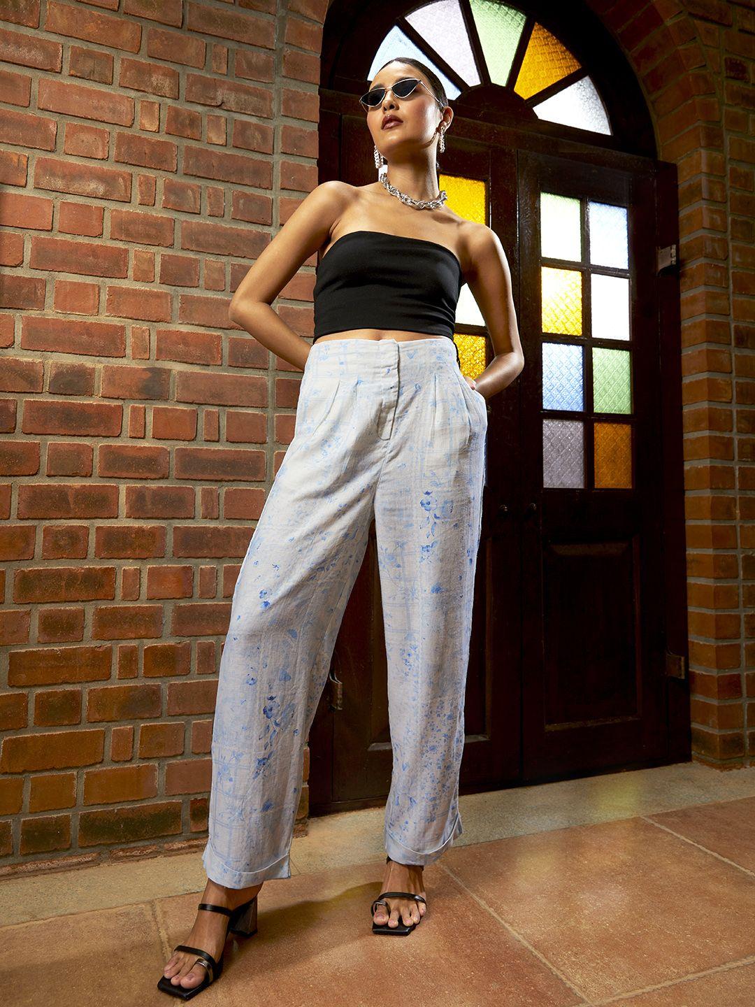 and women blue floral printed loose fit trousers