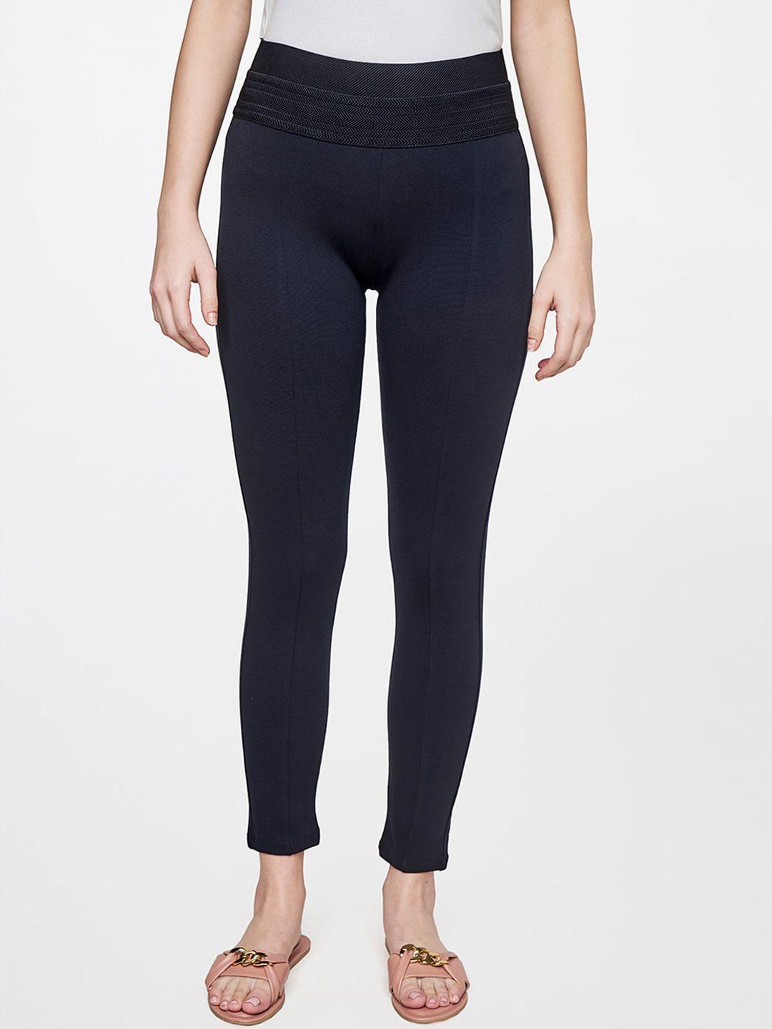 and women blue solid skinny fit trousers