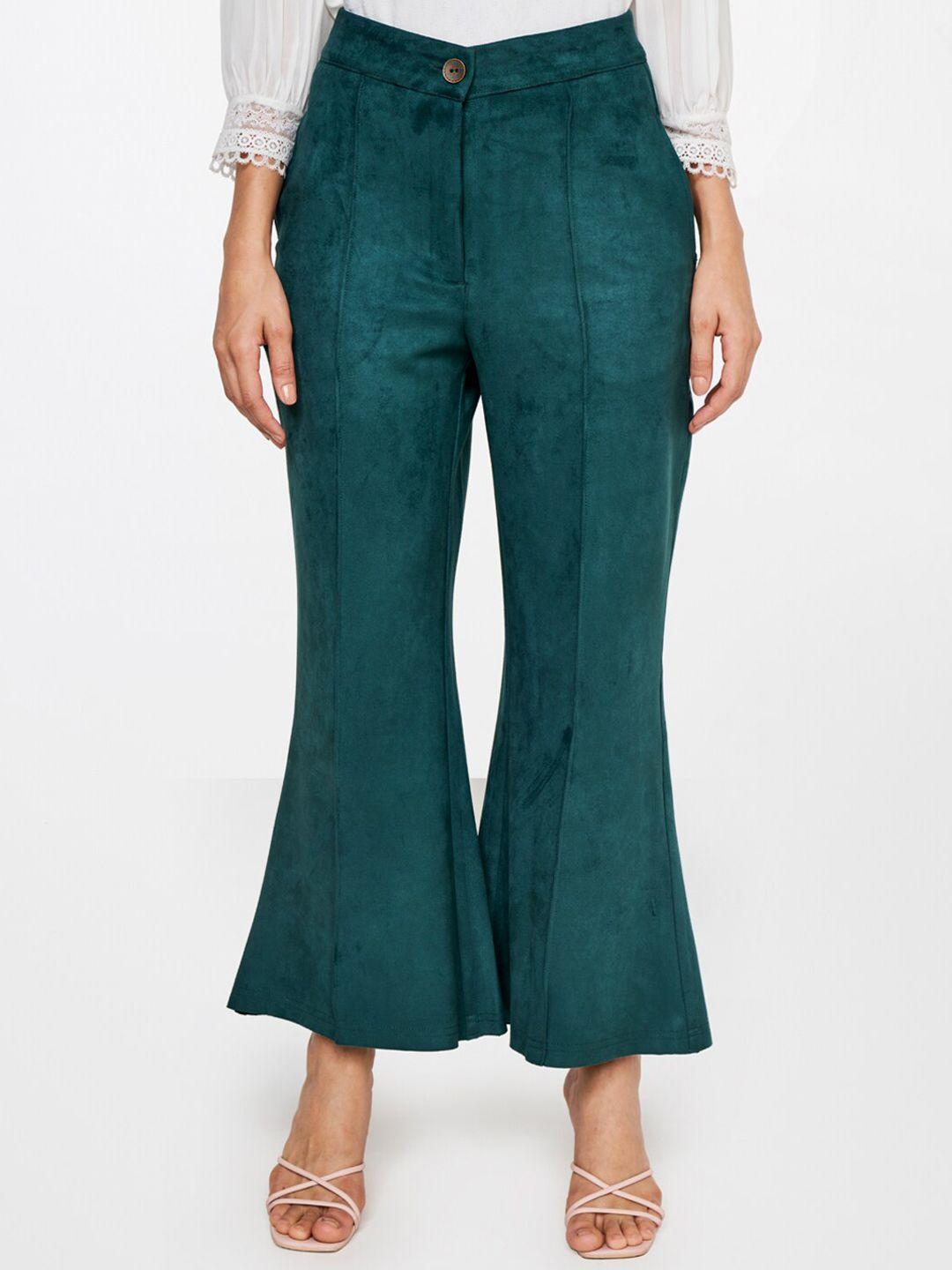 and women green flared trousers