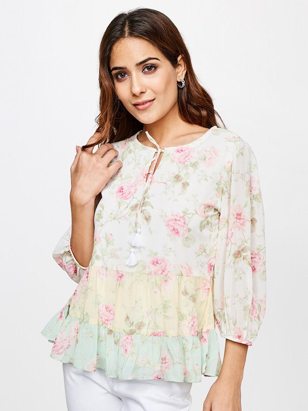 and women pink an white floral print top
