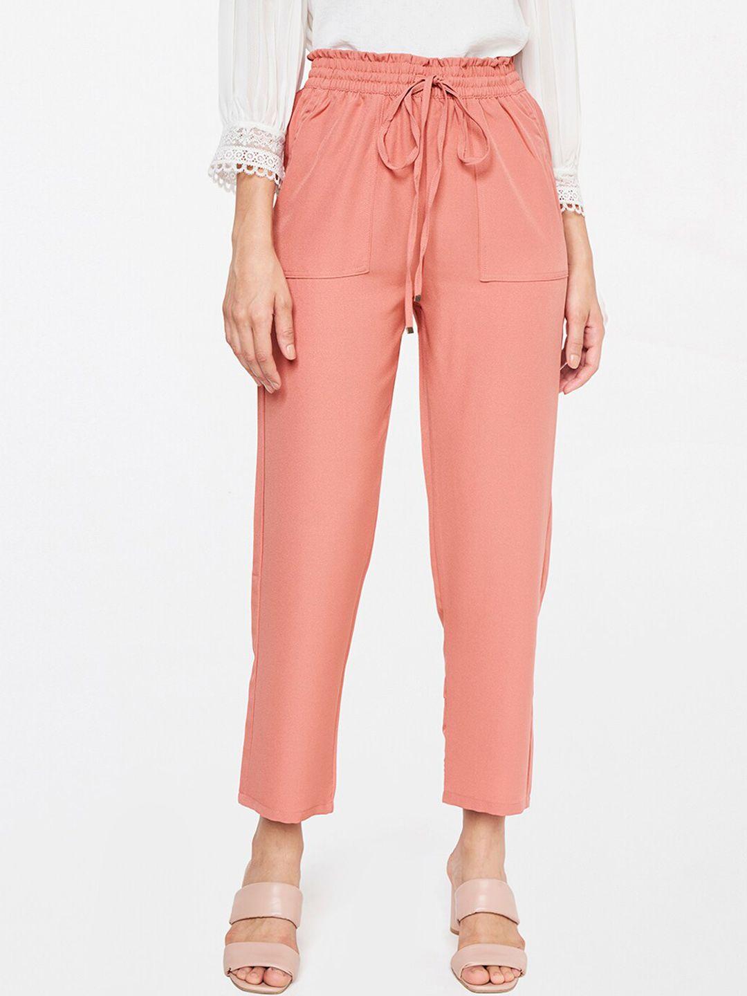 and women pink trousers