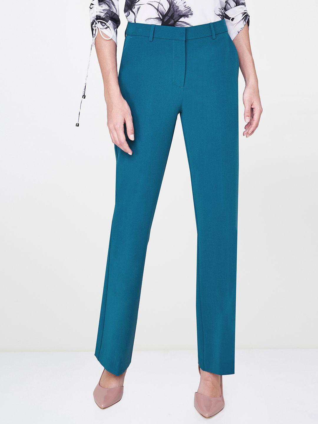 and women teal blue slim fit solid bootcut trousers