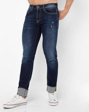 anders lightly washed slim fit jeans with distress