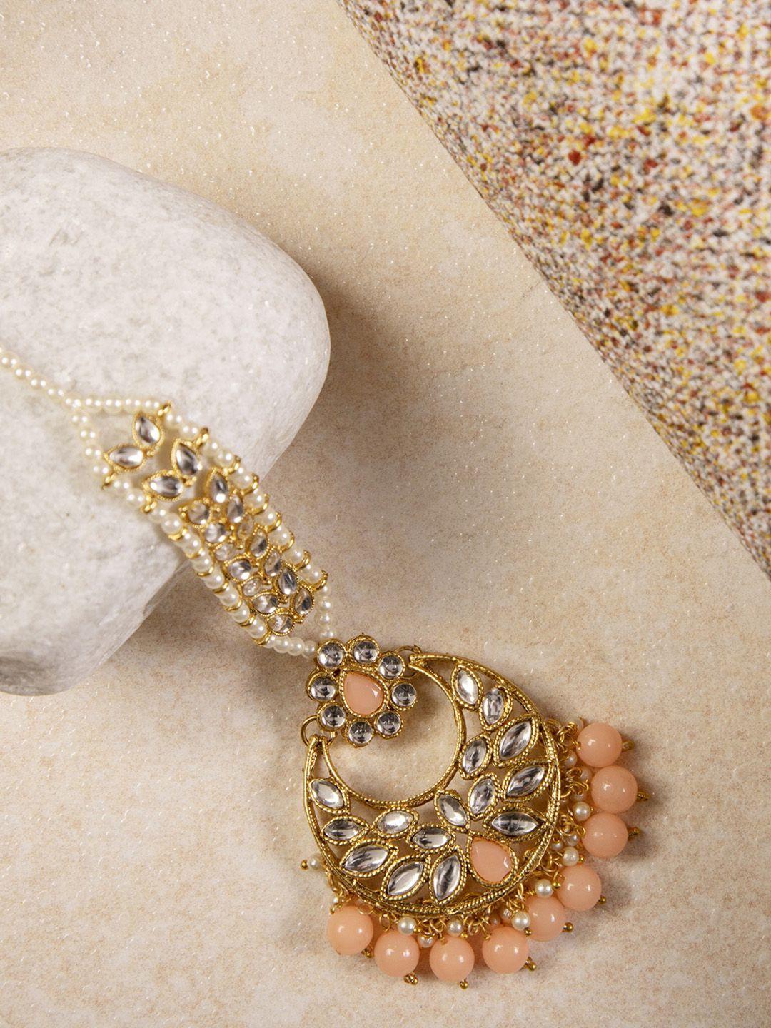anikas creation women gold-plated & peach-coloured kundan & pearl embellished matha patti