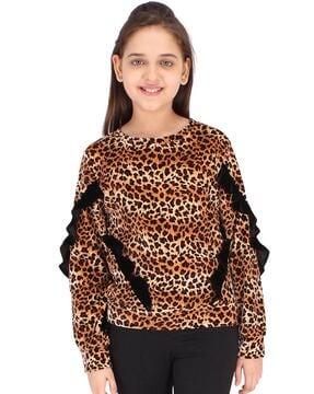 animal print top with ruffle accent