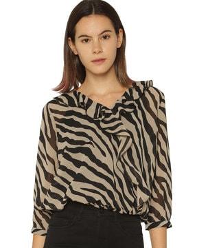 animal print top with ruffled overlay