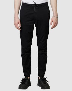 ankle-length joggers with elasticated drawstring waist