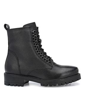 ankle-length leather boots with buckle fastening