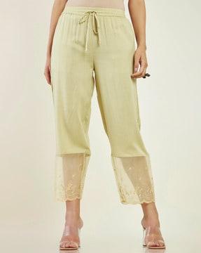 ankle-length pants with embroidered hem