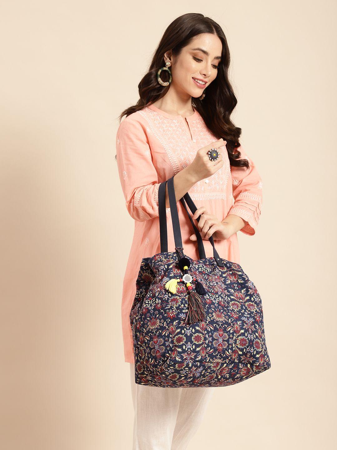 anouk floral print oversized structured shoulder bag with tasselled detail