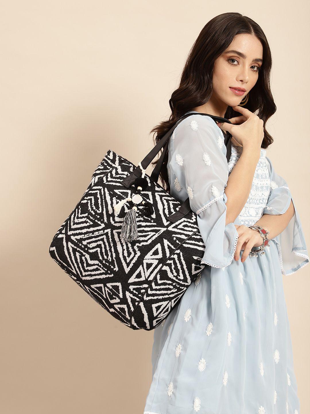 anouk geometric design structured shoulder bag with tasselled detail