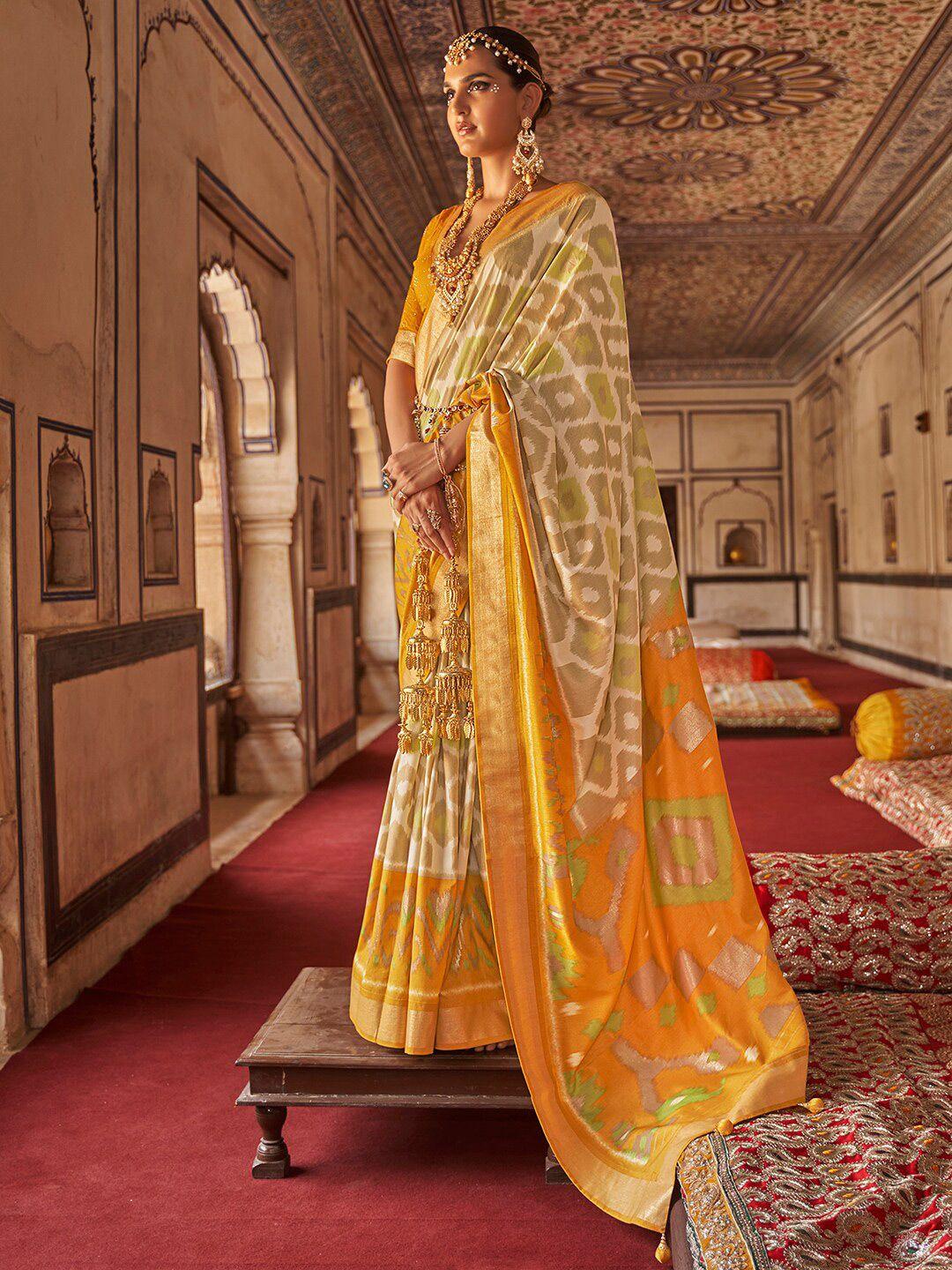 anouk cream-coloured & orange ethnic motifs zari silk blend ikat saree